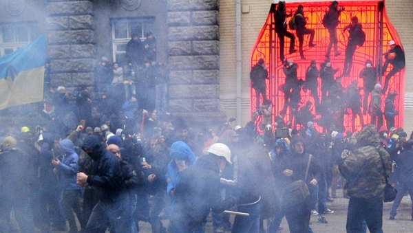 Protesters fired flares at police who threw them back and shot stun grenades into the crowd
