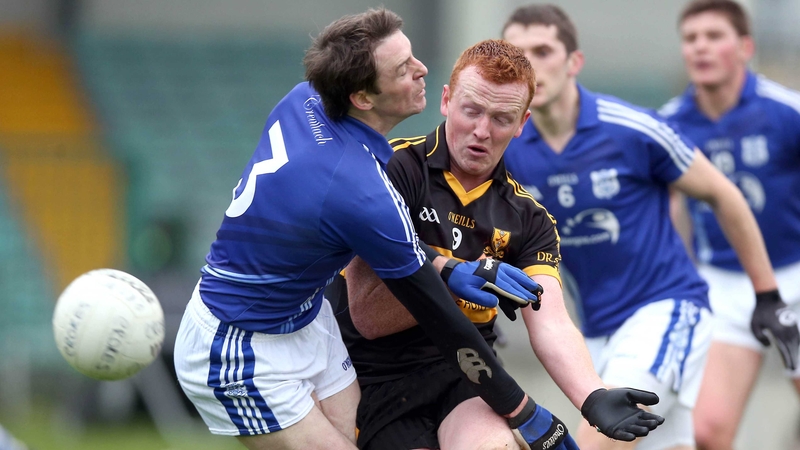 Johnny Buckley of Dr Crokes and Cratloe's Barry Duggan jostle for possession
