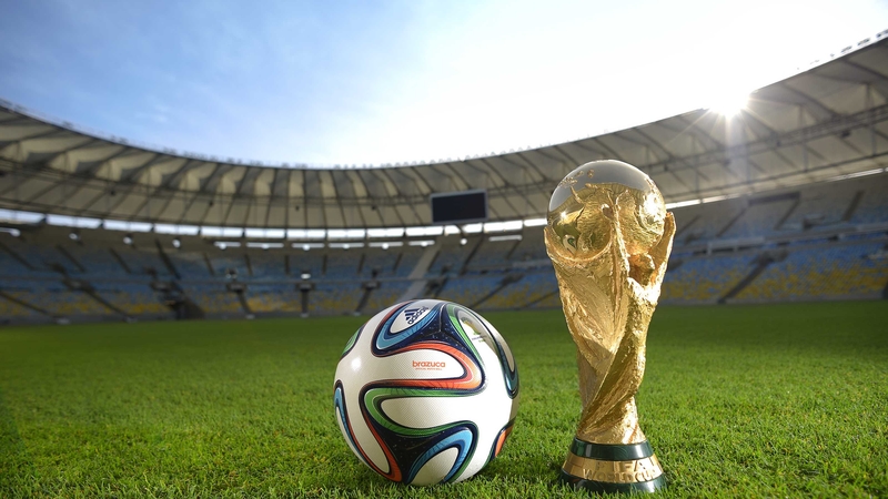 A view of Brazuca - the ball that will be used at next summer's tournament - and the FIFA World Cup trophy at the Maracana