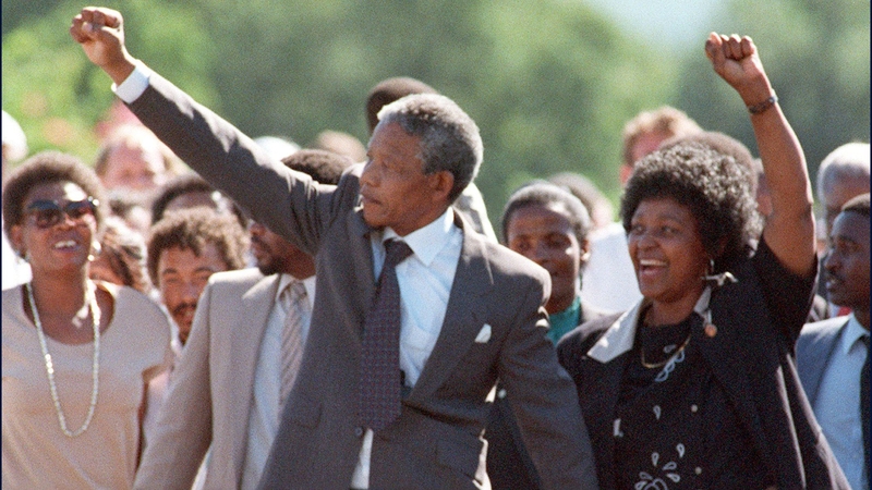 Nelson Mandela and then wife Winnie raise their fists upon his release from prison on 11 February 1990