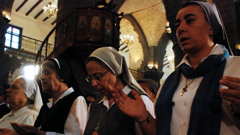 Nuns attend a prayer vigil for peace at the Lady of Dormition, the Melkite Greek Catholic patriarchal cathedral in the Old City of Damascus