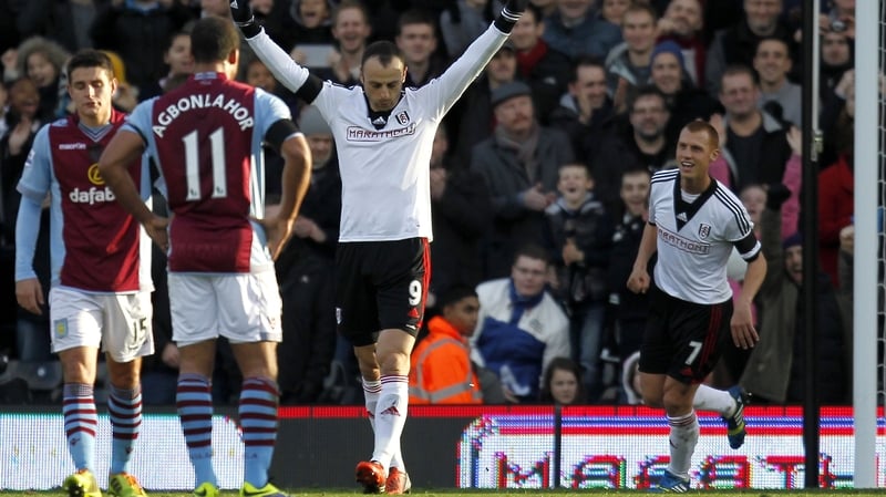 Dimitar Berbatov celebrates after scoring from the penalty spot