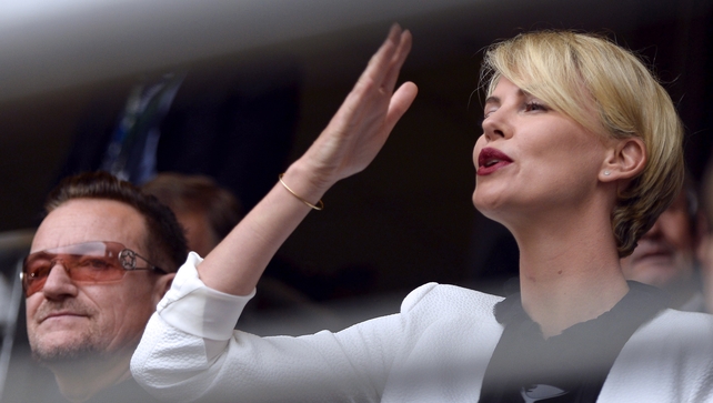 U2 singer Bono and South African actress Charlize Theron were among those in the crowd