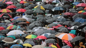 Tens of thousands of people braved torrential rain to attend the event