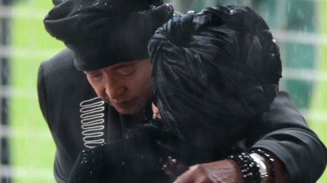 Nelson Mandela's former wife, Winnie Madikizela-Mandela (L) embraces his wife Graca Machel