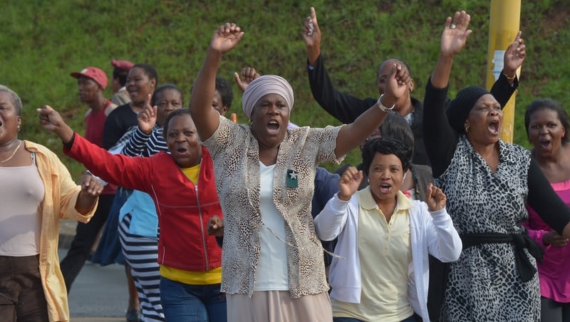 People cheered as the funeral cortege passed