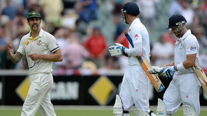 Mitchell Johnson exchanges words with Stuart Broad and Matt Prior of England as they leave the field