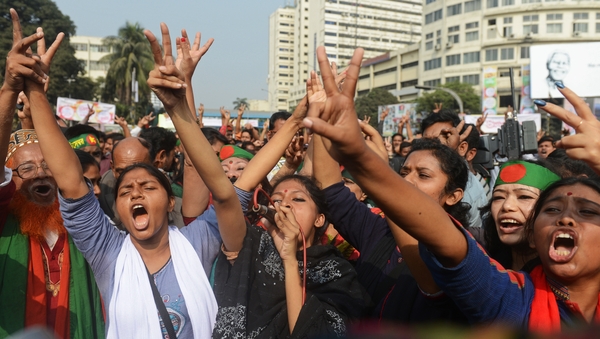 Bangladeshi social activists celebrate following the dismissal of Abdul Quader Molla's appeal against his execution in Dhaka
