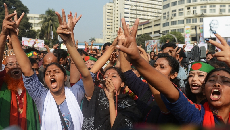 Bangladeshi social activists celebrate following the dismissal of Abdul Quader Molla's appeal against his execution in Dhaka