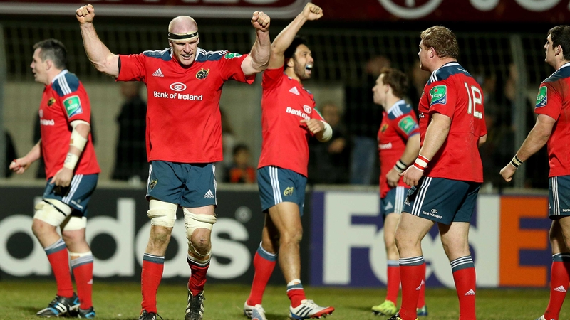 Munster players celebrate after a gruelling victory in Perpignan