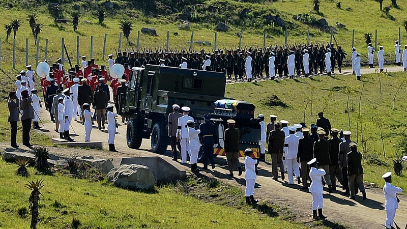 The funeral procession makes its way towards the compound where the funeral ceremony took place