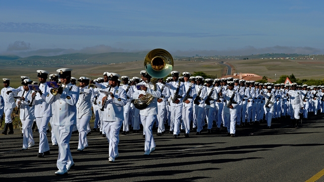 South African armed forces parade as part of the funeral procession