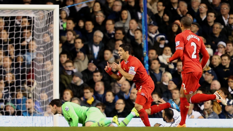 Luis Suarez opens the scoring for Liverpool