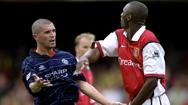 22 Aug 1999: Roy Keane of Manchester United clashes with Patrick Vieira of Arsenal.