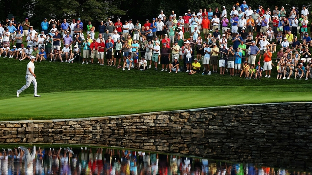 Adam Scott of Australia walks across the 15th green during the PGA Championship in Rochester, New York