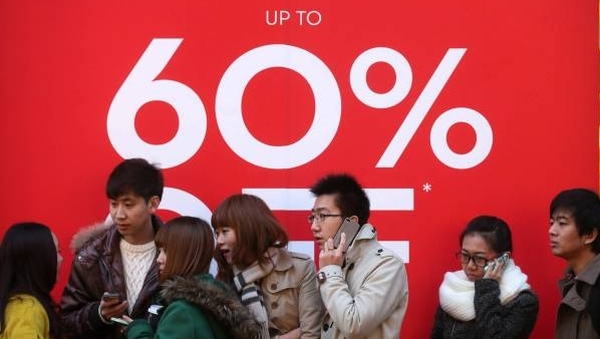 Shoppers queue outside Brown Thomas in Dublin for the start of the winter sale (pic: Photocall/Laura Hutton)