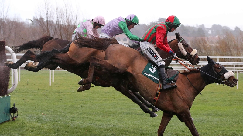 Jockey Bryan Cooper onboard Benefficient clears the last fence on his way to winning the Paddy Power Dial-A-Bet Chase