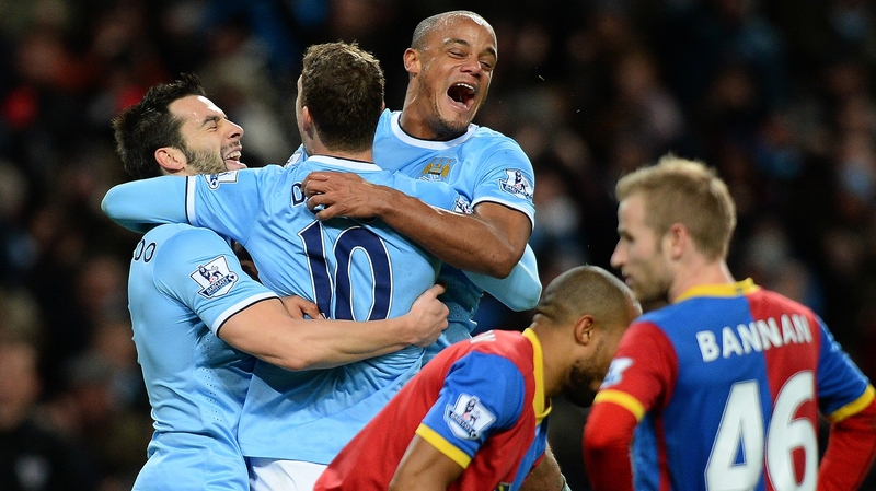 Edin Dzeko (No 10) celebrates what proved to be the winning goal with Alvaro Negredo (left) and Vincent Kompany (right)