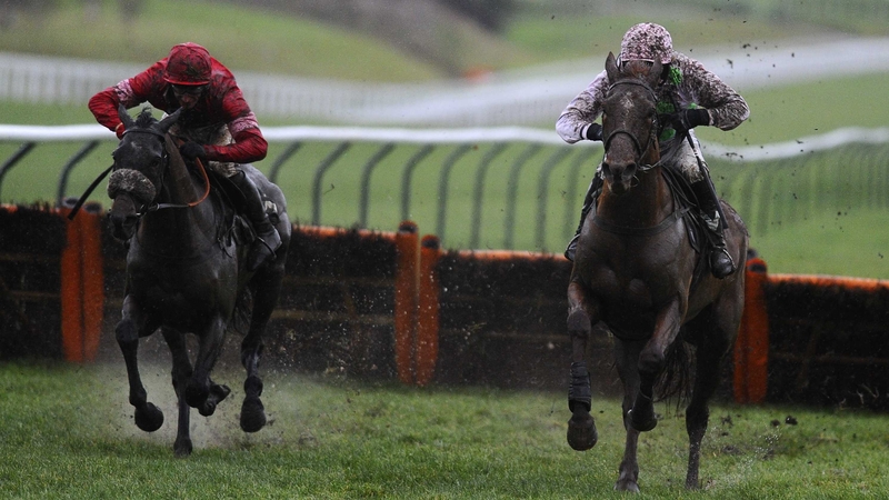 Annie Power (r) gallops away from Zarkandar after negotiating the final hurdle at Prestbury Park