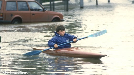 Boy canoes through the floods in Ballsbridge, Dublin in 1986. But who is he?