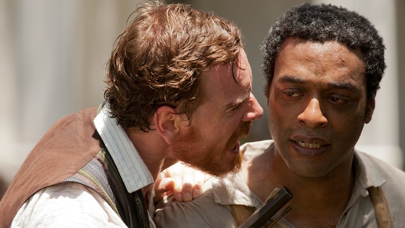 Michael Fassbender and Chiwetel Ejiofor as Solomon Northup in 12 Years a Slave