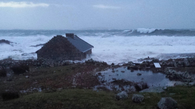 A cottage at Roundstone, Co Galway is battered by waves (Pic: Martha Ryan)