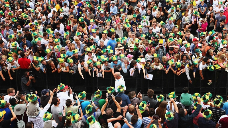 Darren Lehmann, coach of Australia, is greeted by supporters at Sydney Opera House