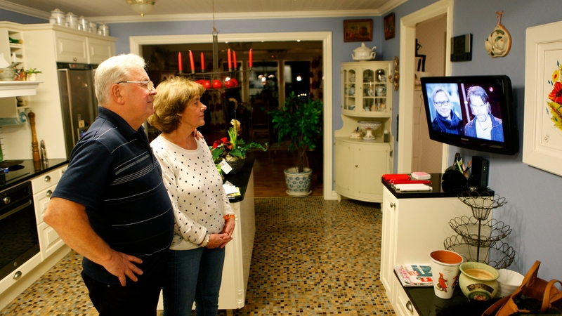 Hans and Gudrun Hammarstroem, parents of photographer Niclas Hammarstroem, watch a news report on his release