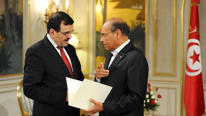 Ali Larayedh (left) submits his resignation to Tunisian President Moncef Marzouk