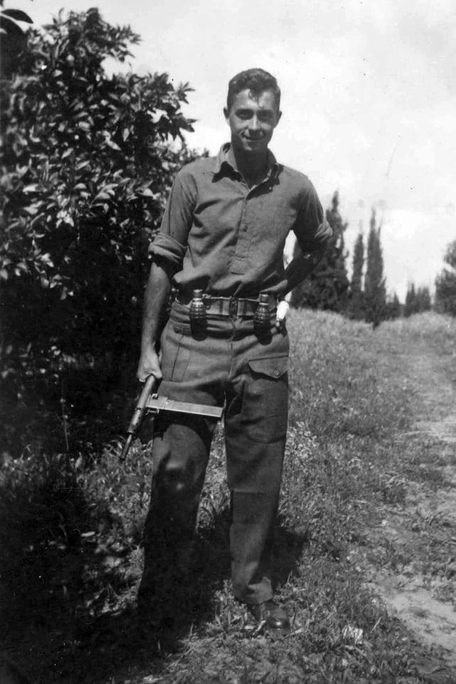 Mr Sharon holds a Sten gun as a young commander in the Alexandroni Brigade of the fledging Israeli army during the War of Independence in 1948