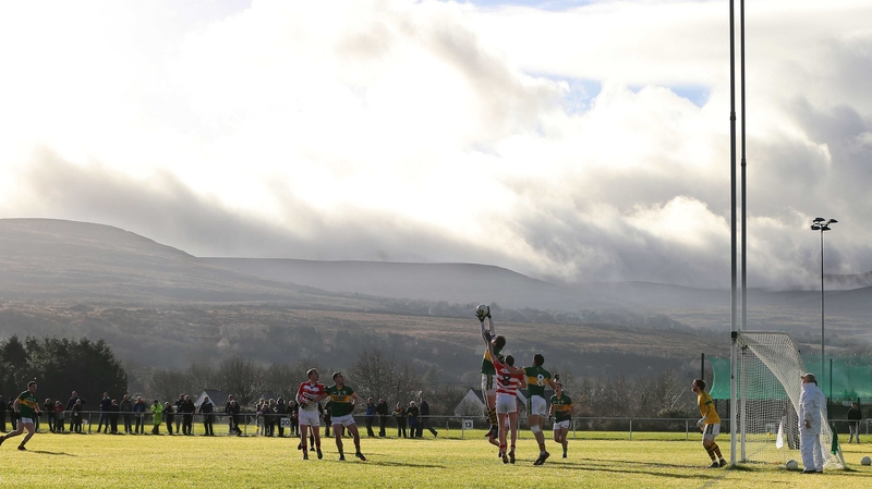 Kerry's Anthony Maher catches a high ball while under pressure from Brendan O'Sullivan of CIT