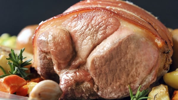 Shoulder of pork with hearty vegetables in a rich