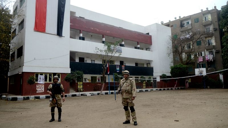 Soldiers standing guard at a polling station ahead of the vote