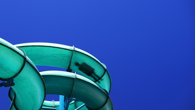 A teenager cools off on a waterslide during a heat wave at Glenelg in Adelaide