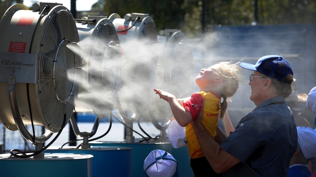 Tennis fans cool off during the heatwave at the Australian Open tennis tournament in Melbourne