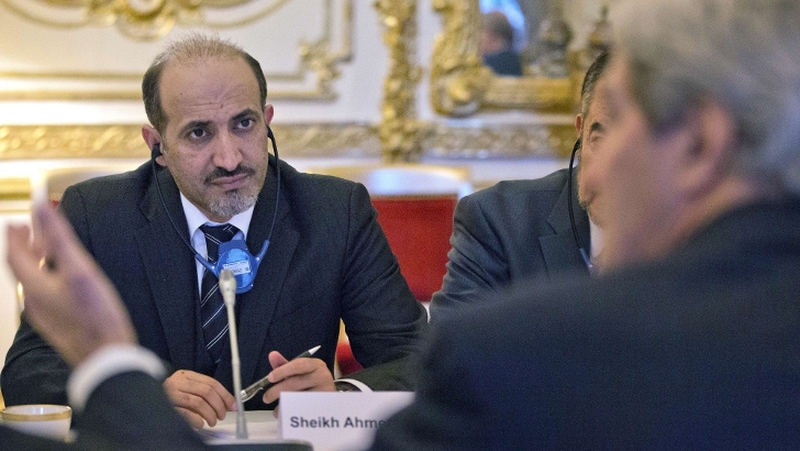 Ahmad al-Jarba said in Istanbul after his National Coalition group that it would attend Wednesday's peace conference in Switzerland