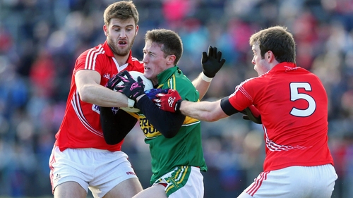 Jonathan Lynne of Kerry with Eoin Cadogan and James Loughrey of Cork