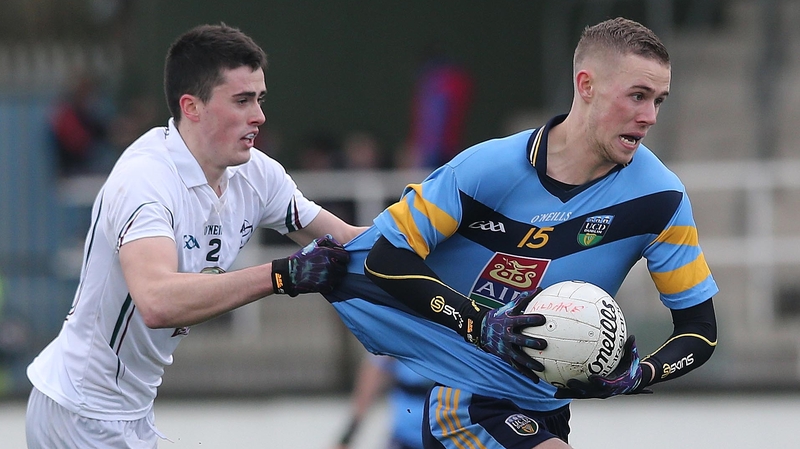 Kildare's Mick O'Grady (l) tackles Paul Mannion of UCD