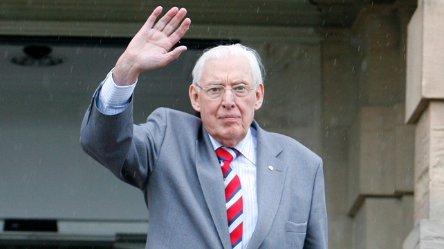 Mr Paisley waves goodbye to the media on the steps of Stormont Castle in Belfast after stepping down as DUP leader in 2008