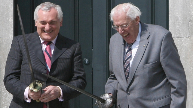 Mr Ahern and Mr Paisley brandish swords during the official opening of the Battle of the Boyne site