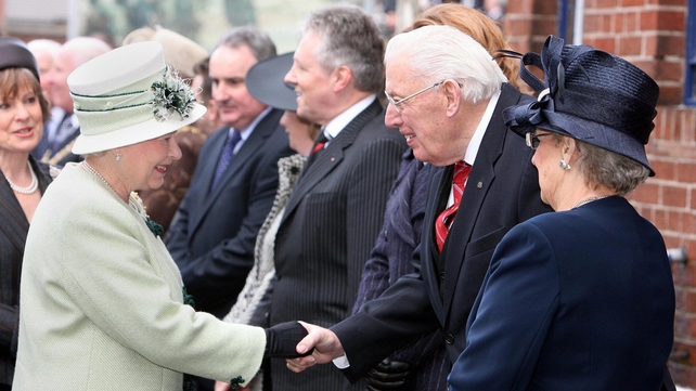 Britain's Queen Elizabeth II (L) meets Mr Paisley and his wife in March 2008