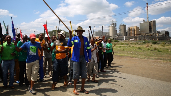 Striking miners near Lonmin's platinum mine in Marikana
