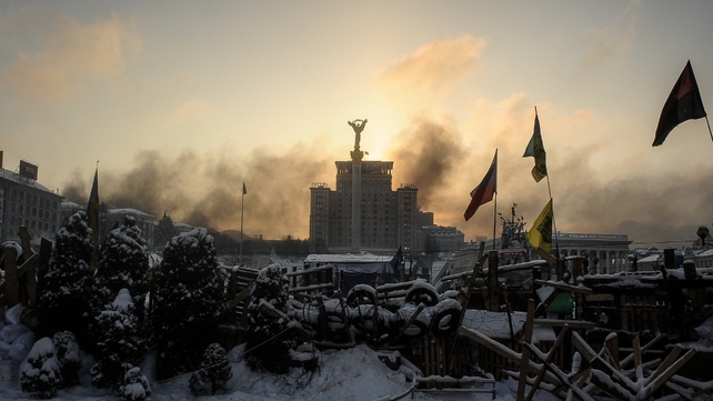 Sunrise above a barricade at the anti-government camp on Independence Square (Pic: EPA)