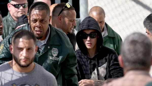 Justin Bieber leaving jail yesterday after posting bail.