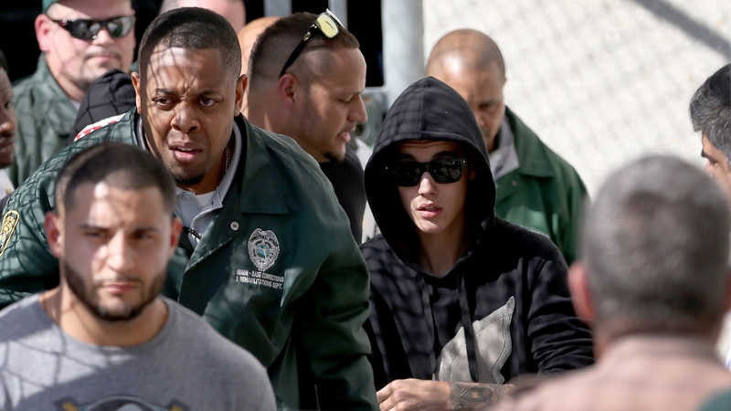 Justin Bieber leaving jail yesterday after posting bail.