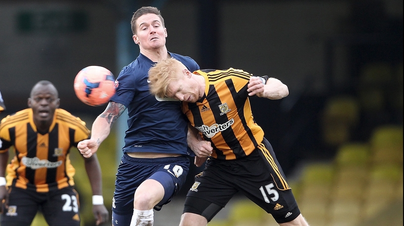 Southend's Barry Corr (left) battles for the ball with Hull City's Paul McShane