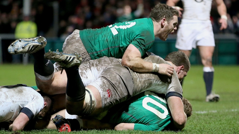 Ireland's Darren Cave celebrates as Ian Madigan goes over for a try