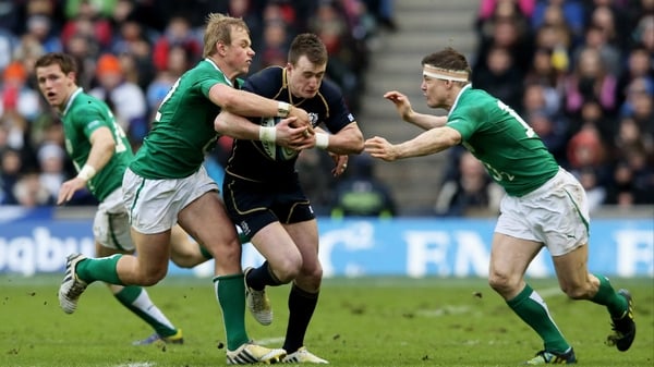 Stuart Hogg is tackled by Brian O'Driscoll and Luke Marshall last year