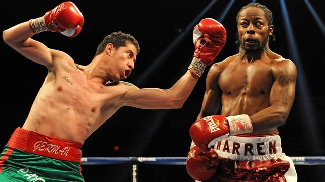 German Meraz attempts to hit Rau'shee Warren in their bantamweight match