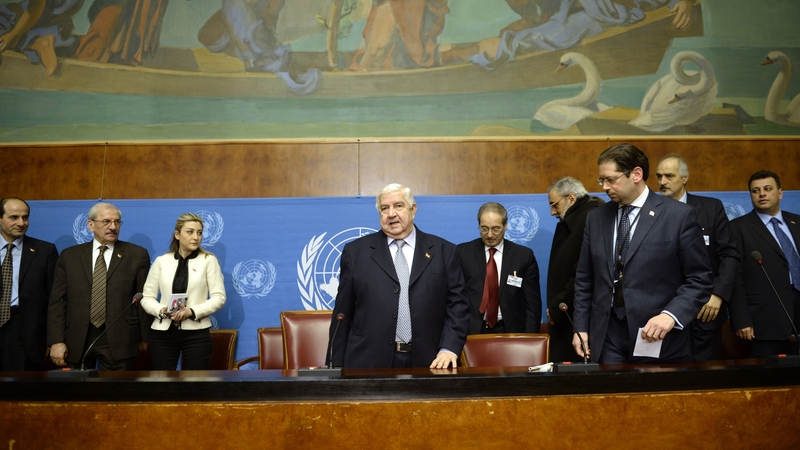 Syria's Foreign Minister and head of the Syrian government delegation Walid Muallem (C) gave a press briefing on the peace talks